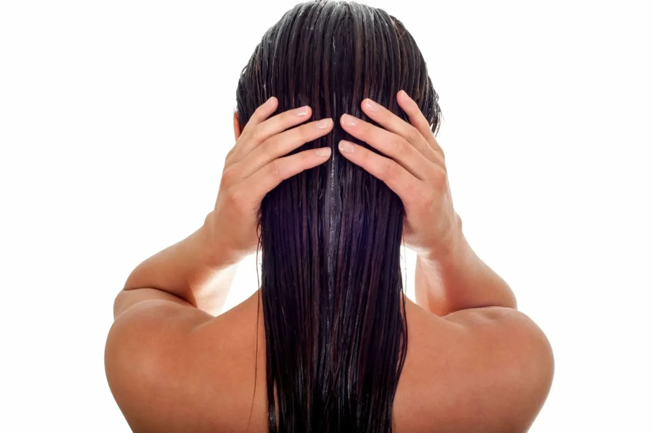 How can you use neem leaves and coconut oil for hair?